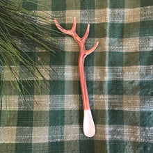 Load image into Gallery viewer, Small matcha spoon with the handle in a shape of an antler. Background is a green checked cloth. 