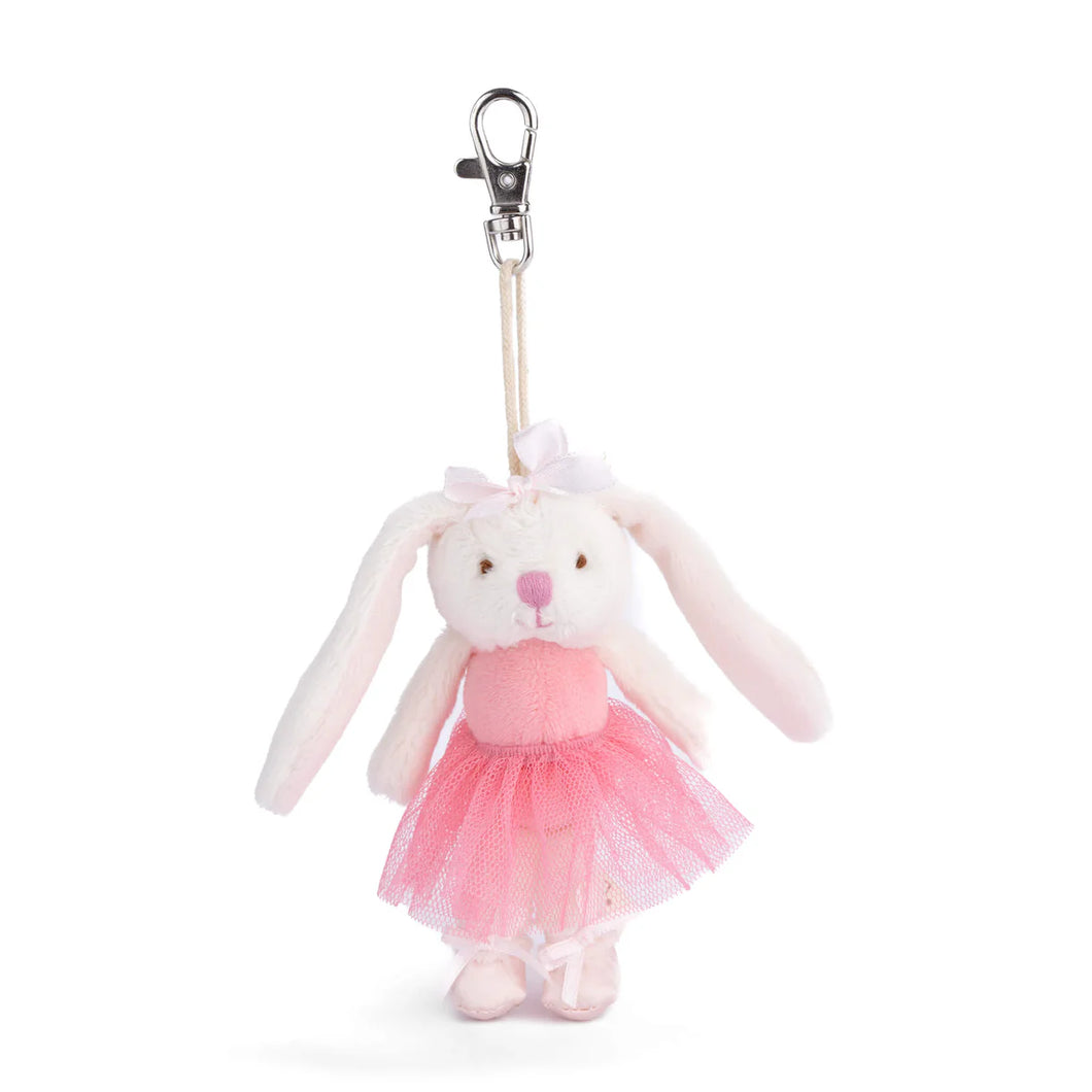 Plush white bunny bag charm wearing a pink tulle ballerina dress with long floppy ears, a pink nose, a small white bow, and white slippers,  hanging from a silver lobster-clasp clip against a white background.  