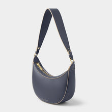 Load image into Gallery viewer, A blue crescent shaped small bag with a gold zipper and accents, with a white background.