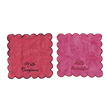 Load image into Gallery viewer, Two pink scalloped edge face towels with &quot;Hello Gorgeous&quot; and &quot;Hello Beautiful&quot; on a white background.