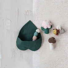 Load image into Gallery viewer, Green leaf-shaped fabric toy holder with plush toys on a textured white surface