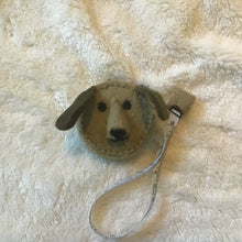 Load image into Gallery viewer, Dog-shaped measuring tape on a soft beige surface