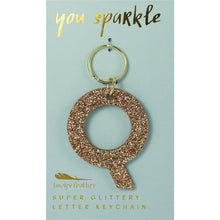 Load image into Gallery viewer, Gold glittery letter &quot;Q&quot; keychain on a light blue card with &quot;you sparkle&quot; in gold text, displayed against a white background.