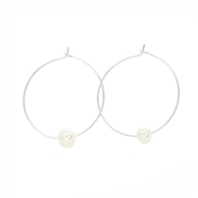 Load image into Gallery viewer, Pair of silver hoop earrings with pearls on a white background