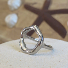Load image into Gallery viewer, Silver ring on a sandy surface with a starfish in the background