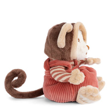 Load image into Gallery viewer, Side view of a white plush bear wearing a monkey-inspired outfit, featuring round cream-colored ears, hands and feet with a brown curled tail. The bear is dressed in a cream-and-salmon striped long sleeves  and salmon-colored corduroy overalls with crossed straps. Bear is sitting upright against a white background. 