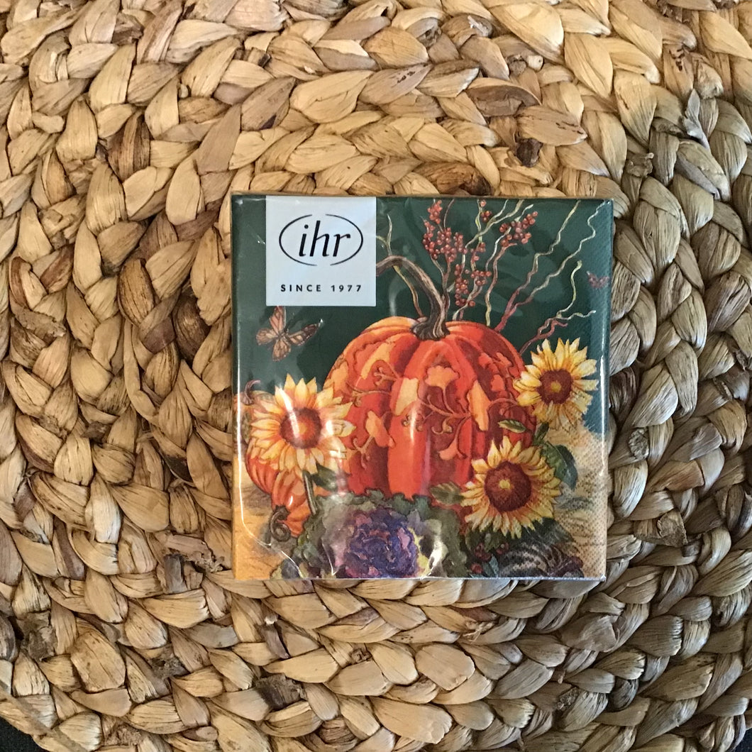 Set of harvest-themed cocktail napkins , wrapped in plastic packaging with a white label in the upper left corner. 