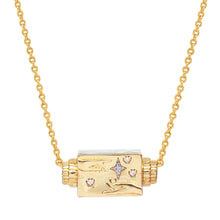 Load image into Gallery viewer, Close-up of a gold-plated necklace featuring a small rectangular spinner pendant with enamel detailing, star motifs, and engraved details, hanging from a delicate gold-tone chain displayed on a white background. 