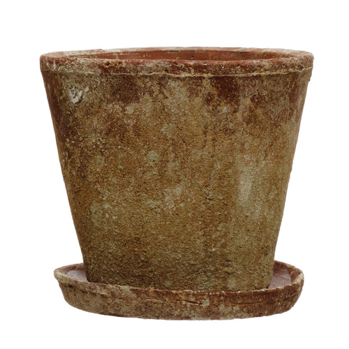 A brown distressed cement planter with a saucer, on a white background.