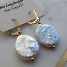 Load image into Gallery viewer, Pearl earrings with gold hooks on a light background
