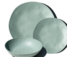 Load image into Gallery viewer, Green melamine dinnerware pieces, including a bowl, dinner plate, and salad plate, displayed together on a white background. 
