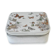 Load image into Gallery viewer, Light gray zippered travel pill box featuring a butterfly and floral illustration, displayed on a white background.