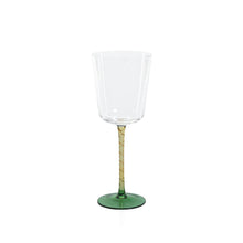 Load image into Gallery viewer, Clear red wine glass with an amber stem and a green circular base displayed on a white background. 