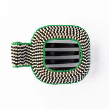 Load image into Gallery viewer, A green, black, and white beaded hairlip on a white background.