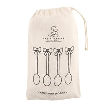Load image into Gallery viewer, Drawstring bag with bow spoon illustrations and "Gold Bow Spoons" in black, displayed on a white background. 