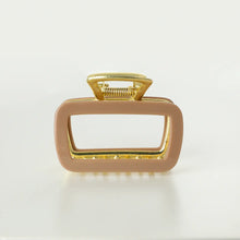 Load image into Gallery viewer, Tan rectangular metal claw clip with gold hardware displayed on a white background.