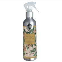 Load image into Gallery viewer, Balsam &amp; Fir, front view of a silver-tone room and fabric spray bottle with a translucent white plastic trigger, a circular Mangiacotti emblem, and a beige wraparound label featuring green evergreen branches, brown pinecones, and a gold-colored panel with the scent name and product type in dark lettering against a white background.