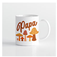 Load image into Gallery viewer, White coffee mug with polka-dotted mushrooms and brown text that reads &quot;Papa&quot;. White background. 