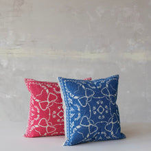 Load image into Gallery viewer, Two patterned pillows, one red and one blue, on a neutral background.