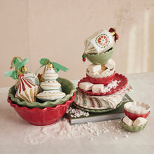 Load image into Gallery viewer, Holiday display featuring stacked red and green stoneware scalloped bowls and plates arranged with cream-colored marshmallows and festive ornaments with bows. A folded striped napkin, book, and  scattered snow complete the Christmas scene on a light surface and background.  