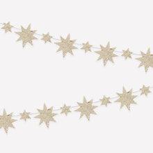 Load image into Gallery viewer, Glittery gold star garland in alternating large and small sizes hanging on a white background. 