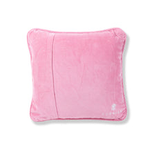 Load image into Gallery viewer, Back view of a pink velvet pillow cover with a neatly stitched overlap closure and a small white embroidered flower logo in the bottom right corner, displayed on a white background. 