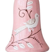 Load image into Gallery viewer, Light pink wooden bell ornament with a white bird and botanical design, shown close up against a white background. 