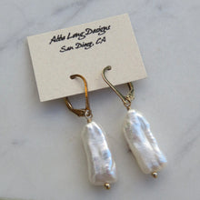 Load image into Gallery viewer, Pearl earrings on a card with &quot;Abbe Long Designs San Diego, CA&quot; text on a marble background