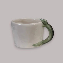 Load image into Gallery viewer, White mug with a green dragon handle on a light gray background