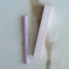 Load image into Gallery viewer, Lilac flameless rechargeable lighter next to its matching box on a marble surface.