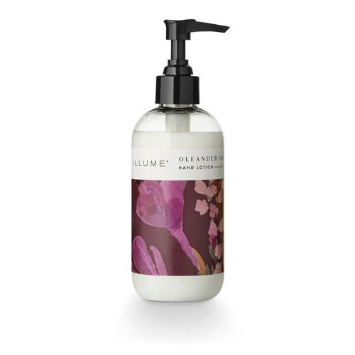 Hand lotion pump bottle with purple floral design on a white background