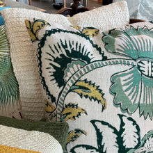 Load image into Gallery viewer, Cotton Botanical Pillow, slubbed large square cotton throw pillow with botanical pattern in shades of teal, mustard, and deep green, styled with layered pillows in background. 