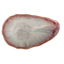 Load image into Gallery viewer, Close-up of the inside of a white and red ceramic glazed bowl on a  white background.