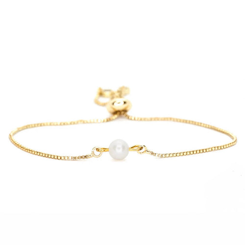Freshwater pearl bolo bracelet featuring a single round pearl on a gold-plated adjustable chain, displayed against a white background. 