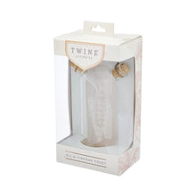 Load image into Gallery viewer, Clear glass oil and vinegar cruet with cork stoppers and an interior grape motif, shown in a boxed package with a clear window, displayed on a white background.  