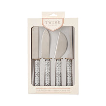 Load image into Gallery viewer, Black-and-white tile-patterned stainless steel cheese knife set packaged in a box labeled "Twine Living Co." on a white background. 