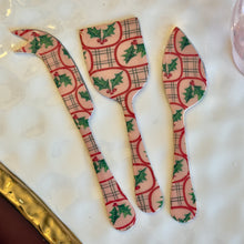 Load image into Gallery viewer, Set of three white enameled stainless steel servers with a festive mistletoe design in red and green. On top of a white surface with a gold border.