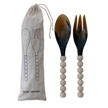 Load image into Gallery viewer, Horn Salad Server Set, tortoise-toned natural horn spoon and fork heads, white resin bead handles, and natural-colored drawstring storage pouch with an illustrated  black salad server outline against white background.  