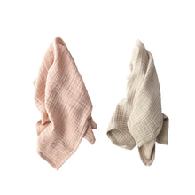 Load image into Gallery viewer, A pink and a white tea towel hanging on a white background.