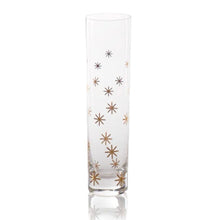 Load image into Gallery viewer, Clear glass champagne flute with scattered gold star decals displayed on a white background. 