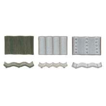 Load image into Gallery viewer, Three various stoneware soap dishes from   an overhead view and a side view. First soap dish is dark green with small spaced vertical ridges. Second soap dish is white with 3  prominent vertical ridges, and the third soap dish is light gray with 3 rows of vertical dots. Against white background. 