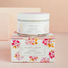 Load image into Gallery viewer, Lollia body butter jar with a floral design on a matching packaging box against a pink background
