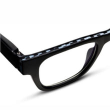 Load image into Gallery viewer, Close-up of black chunky square reading glasses with black and white checkered pattern along the top edge, displayed on a white background. 