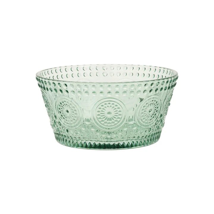 Green glass bowl with an embossed  pattern on a white background.