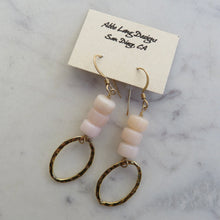 Load image into Gallery viewer, Pair of earrings with 3 stacked  pink beads and gold loops on a marble surface with a card labeled &quot;Aubrey Long Designs San Diego, CA&quot; card.