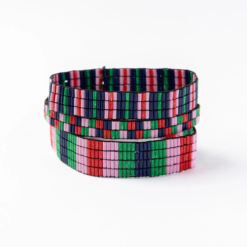A set of three beaded stretch bracelets with a different geometric patterns in multiple colors including blue, pink, green, and red. On a white background. 
Ethically produced from India.