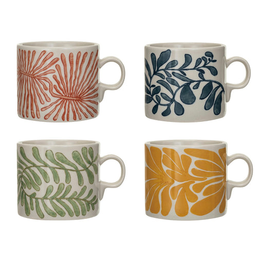 Red, blue, green, and yellow ceramic mugs with leaf patterns on a white background.