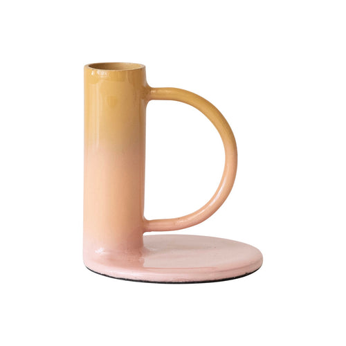 Beige  and pink ceramic taper candle holder on a white background.