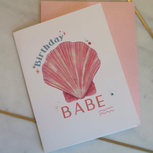 Greeting card with a pink shell and 