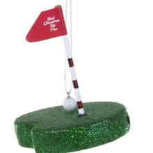 Load image into Gallery viewer, Putting Green Ornament, angled view of a painted glass putting green with a glittery green base, small white golf ball, and red-and-white striped flagpole topped with a red “Best Christmas By Par” flag, with a silver-colored hanging cord, against a white background.
